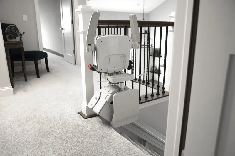 /content/image/Products/Stairlifts/Bruno Elan Stairlift/bruno-elan-folded-top-of-stairs.webp